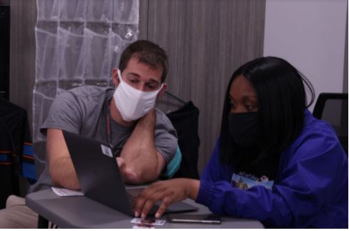 Coppell High School AP statistics teacher Paul Lidster assists CHS senior Kayla Mitchell during his fourth period class on Thursday. Lidster has taught various subjects at CHS such as algebra I and II, geometry and AP statistics.
