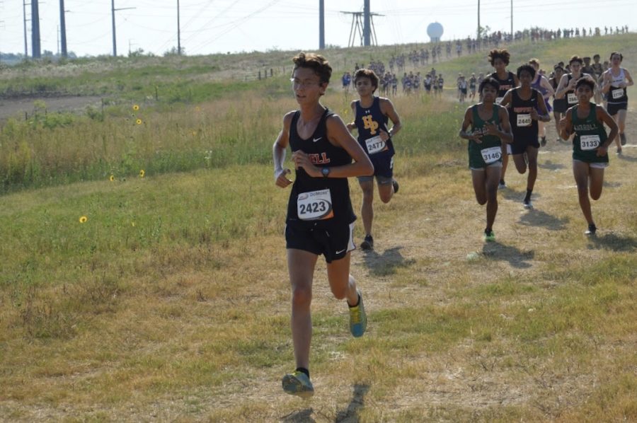 Coppell junior Lane Jacobs stays ahead of a pack at the Coppell Invitational on Sept. 4, 2019 at the course at Coppell Middle School West.