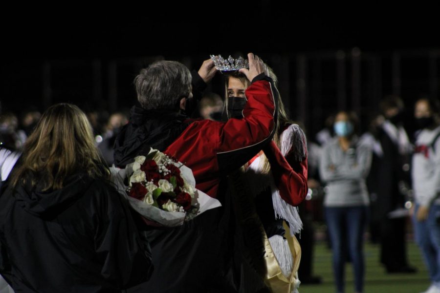 Coppell High School senior Maggie Castranova is crowned homecoming queen by CHS Principal Laura Springer on Friday at Buddy Echols Field. The homecoming court and crowning took place at halftime during the football game against Plano West.