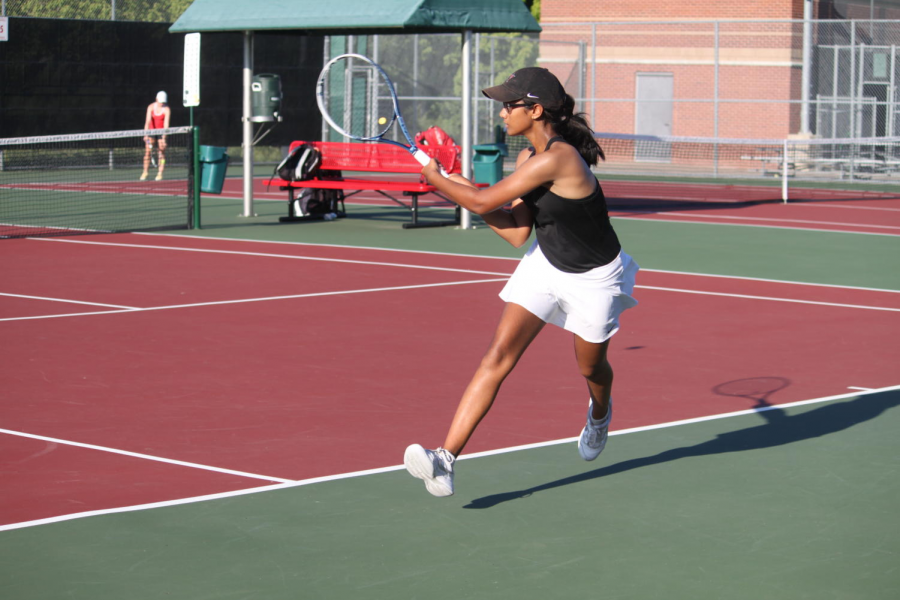Coppell+senior+co-captain+Rishita+Uppuluri+hits+a+backhand+during+her+doubles+match+against+Marcus+on+Sept.+18%2C+2018+as+a+sophomore.+Uppuluri+values+the+relationships+she+has+created+during+her+four+years+on+varsity+tennis+more+than+winning+or+losing.+%28Sidekick+file+photo%29+