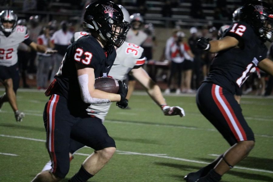 Coppell sophomore defensive back Matthew Williams returns an interception off Marcus senior quarterback Garrett Nussmeier on Nov. 6 at Buddy Echols Field. Williams is one of many multisport athletes, competing in football, track and baseball. 