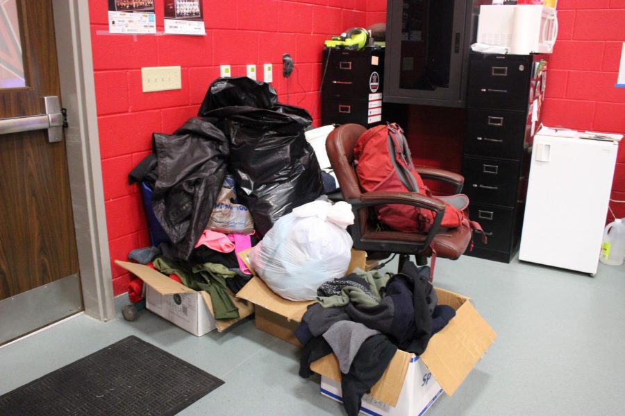 Coats and warm clothes are stored in the wrestling team’s room in the CHS Indoor Facility on Thursday. Despite the cancellation of the annual Santa Slam tournament, the wrestling coat drive is taking place through Dec. 18.