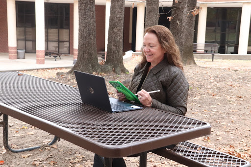 Former Coppell High School algebra II teacher Michelle Bellish prepares materials for her tutoring classes on Dec. 2 outside CHS. Bellish recently retired after 32 years of teaching because of COVID-19 and now has her own math tutoring service. Photo by Tracy Tran