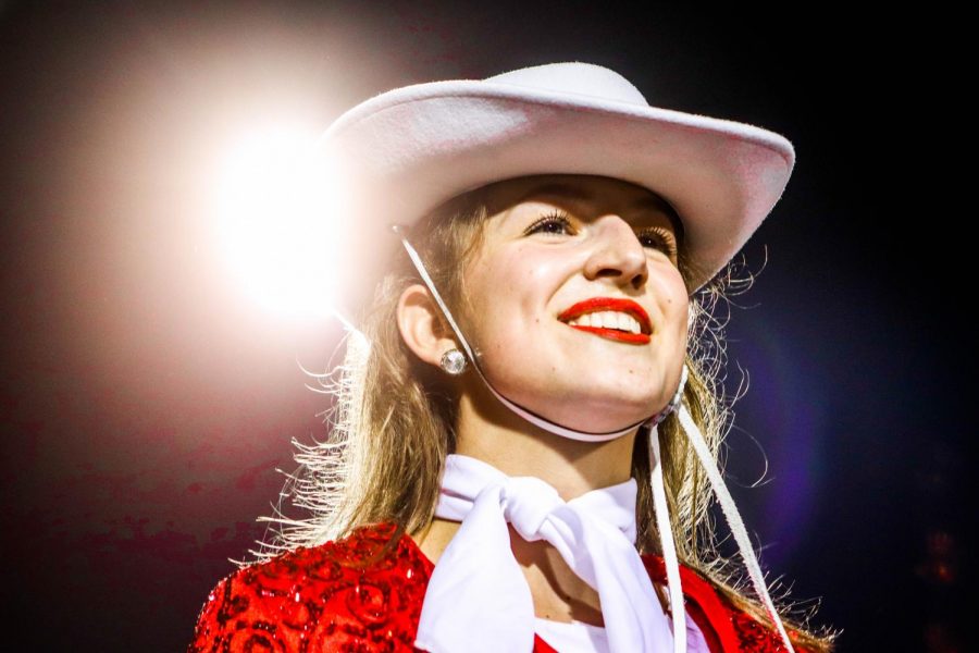 Coppell Lariette junior lieutenant Chloe Landerfeld looks into the crowd under the Friday night lights after the Senior Night Lariette halftime routine during the game against Lewisville on Nov. 20 at Buddy Echols Field. The Cowboys fell to the Farmers, 39-14.