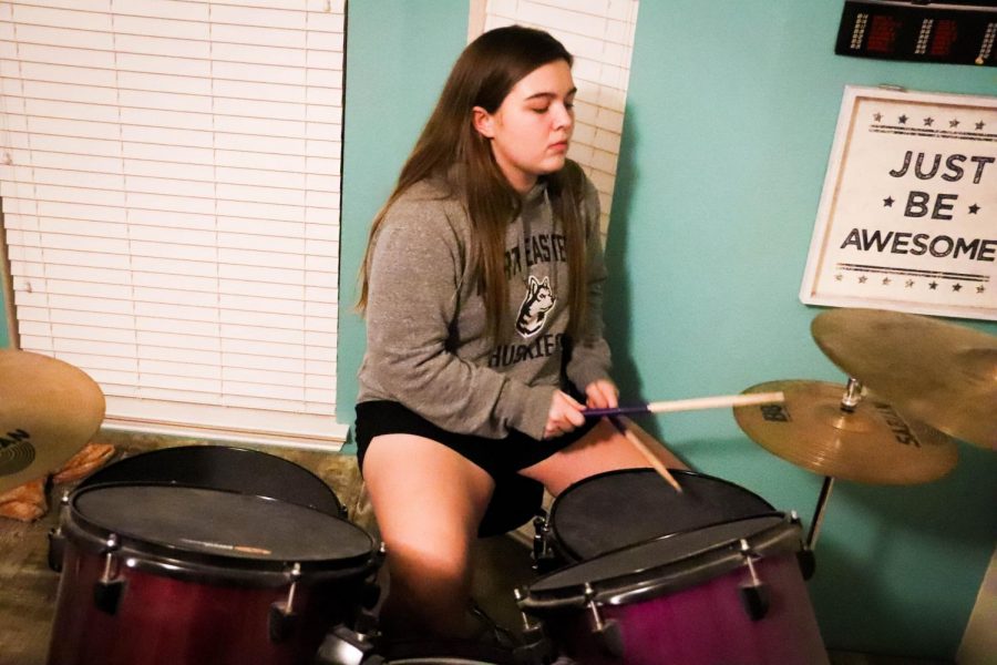 Coppell High School senior Jacqueline Gamborino plays drums at her house on Monday. Gamborino has been playing the drums ever since she was little and is on the Coppell tennis team. 