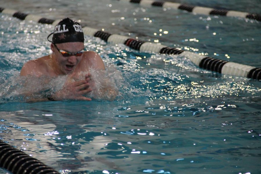 Coppell sophomore Asher Johnson practices his breaststroke during practice on Nov. 19 at the Coppell YMCA. Johnson switched from playing football to swimming after an injury, rising to the varsity A team after just one year. 