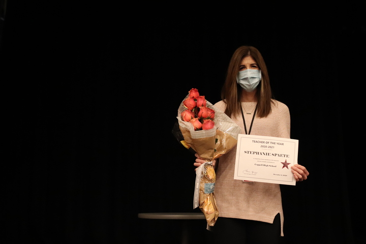 Coppell High School IB English teacher Stephanie Spaete is awarded roses and a certificate in the CHS Auditorium during first period Wednesday. Spaete was named CHS’s 2020-21 Teacher of the Year. Photo by Lilly Gorman
