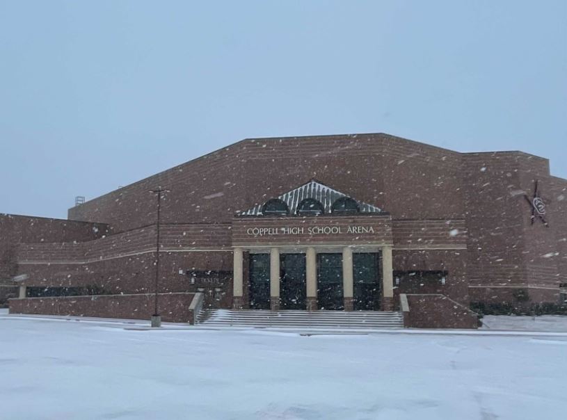 Coppell High School is surrounded by snow as the parking lot ices over on Sunday. Coppell ISD will be closed for in person and virtual learning this Tuesday and Wednesday. 