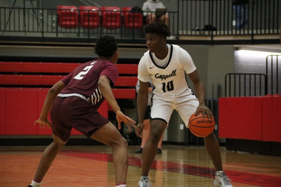 Coppell+junior+guard+Naz+Brown+looks+for+an+open+teammate+against+Plano+junior+guard+Makhi+Dorsey+on+Friday+in+the+CHS+Arena.+Brown+joins+3d+Hoops+Academy+teammates+junior+guards+Anthony+Black+and+Ryan+Agarwal+at+Coppell+after+transferring+from+Hurst+L.D.+Bell.