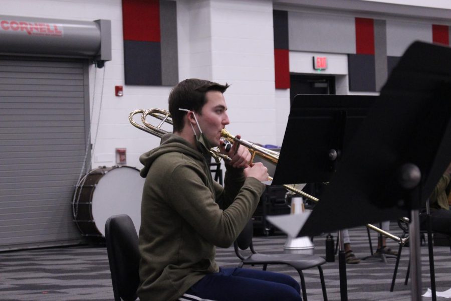 Coppell High School senior drum major Wyatt Andrews plays his trombone in the band hall during third period on Thursday. Andrews has been in band since sixth grade and plans to pursue musical education after high school.