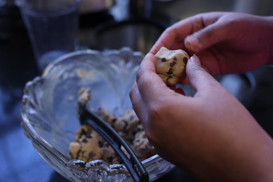 The Sidekick advertising and circulation manager Trisha Atluri molds edible cookie dough at her home on Jan. 18. These heart-shaped treats are the perfect dessert for Valentine’s Day.