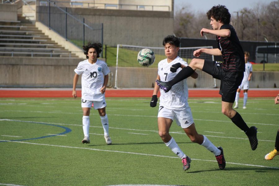 Coppell senior defender Daniel Nelson gains control of a pass against Frisco Rock Hill sophomore forward Isaac Sorenson and freshman midfielder Ashton Medina on Saturday at Buddy Echols Field.Coppell defeated Rock Hill, 3-0.