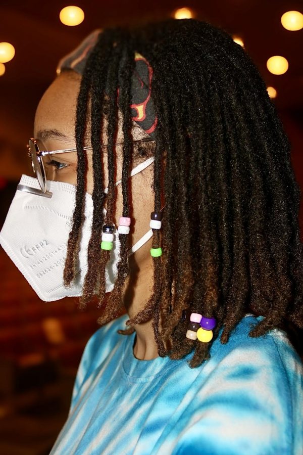 Coppell High School senior M.J. Green displays the locs and beads hairstyle in the Black Box Theater at CHS on Wednesday. Green is a student in theater and the historian for the Drama Club and hopes to be an archivist.