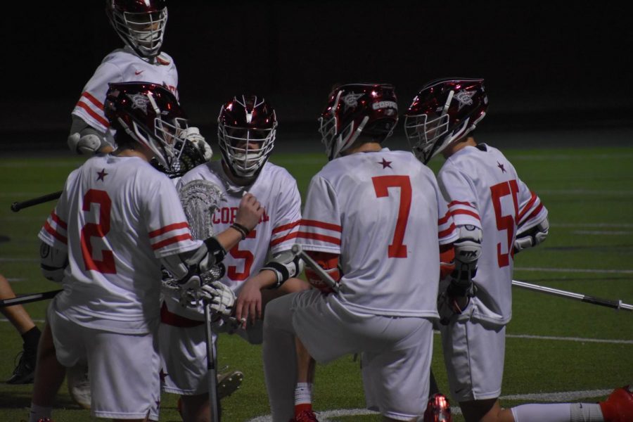 Coppell senior attackmen Gavin Osteen, Aidan Stricklin and Dylan Colon as well as senior midfielder Andrew Sullivan listen to senior midfielder Tyler Wendel as he directs offensive strategy against Plano West at Coppell Middle School North on Tuesday. The Cowboys host national powerhouse IMG National this evening at Lesley Field, with faceoff at 5:30 p.m.