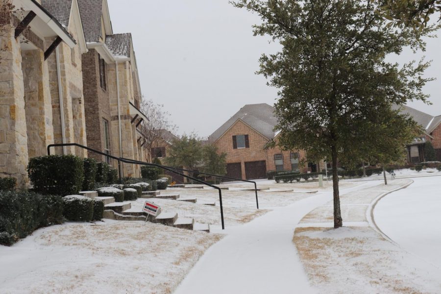 Snow covers the rooftops of homes in the Hemingway Community in Valley Ranch on Sunday. Coppell experienced snowfall on Sunday, and there is a winter storm warning for the Dallas-Fort Worth area as per the National Weather Service.