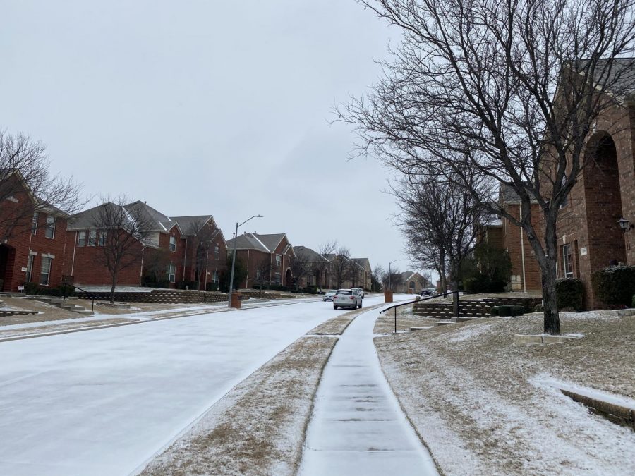 Roads and sidewalks are covered in snow in the Hills of Valley Ranch neighborhood on Sunday. Coppell experienced snowfall on Sunday, and there is a winter storm warning for the Dallas-Fort Worth area as per the National Weather Service.