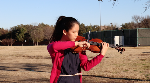 Coppell High School junior Jessica Liang plays her violin at Cimarron Park on Jan. 25. Liang is a part of the string quartet of the Chamber Music International Youth Ambassadors Organization.