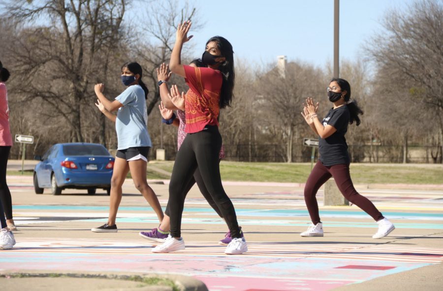 Coppell High School sophomore Mihira Kada rehearses her Vivace! performance “Home” by Philip Philips at the CHS parking lot on Sunday. Kada was named co-captain of Vivace! early second semester. 