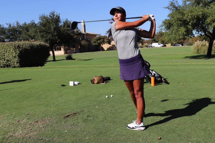 Coppell senior golfer and University of Texas at San Antonio commit Lauren Rios finishes a swing at the Cowboys Golf Course on Oct. 13. Rios is one of many Coppell athletes who have verbally committed to collegiate athletics.