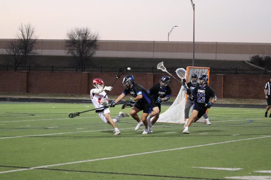 Coppell senior attacker Dylan Colon catches against IMG National on Feb. 24 at Coppell Middle School North. The Coppell boys lacrosse team lost, 19-6, to IMG National and the Cowgirls lost, 15-9, to Rockwall.