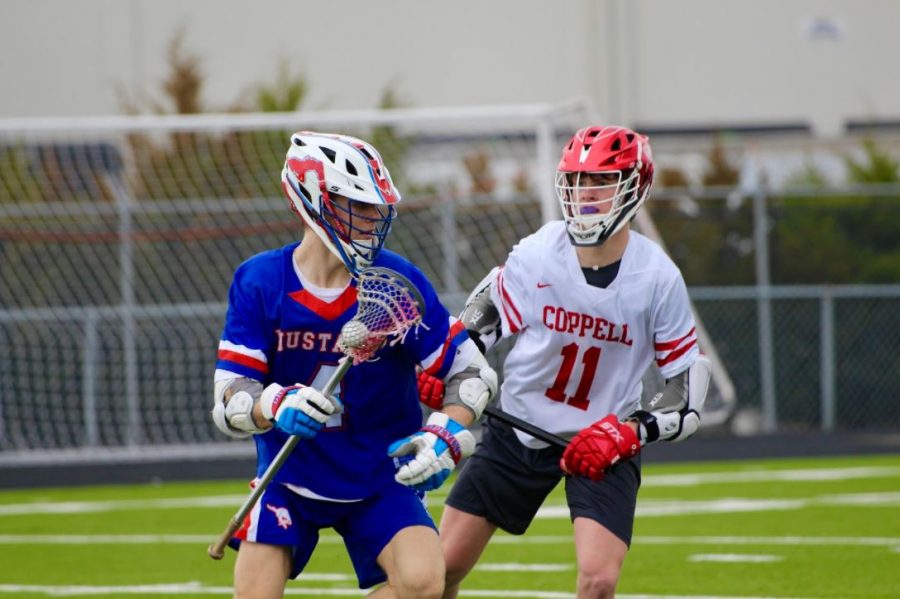 Coppell senior midfielder Graham Wharton defends Grapevine junior midfielder Logan Park Sunday afternoon at Lesley Field. The Cowboys defeated the Mustangs, 17-5.