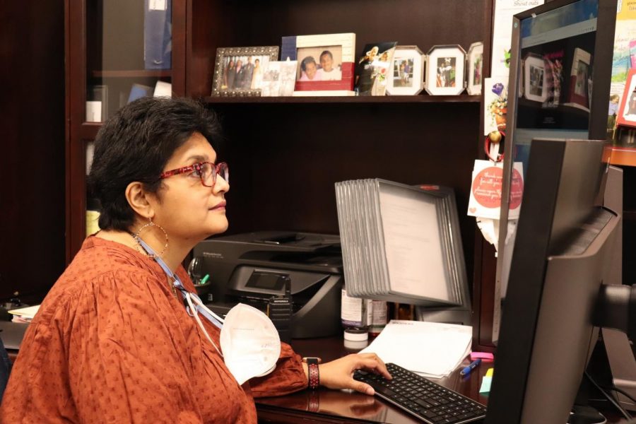 Coppell High School administrative assistant to the associate principal Veena Bhat works in her office on March 22. Bhat has worked as a library assistant and substitute teacher in the educational field, as well as with advertising for Gulf Air and American Airlines prior to her current position. 