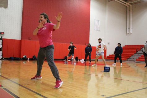 Coppell High School aerobic activities and dance I teacher Julie Stralow leads her sixth period class through aerobics warm-ups on April 23 in the small gym. Starlow was selected by The Sidekick staff as the sixth Teacher of the Issue for the 2020-21 school year. 