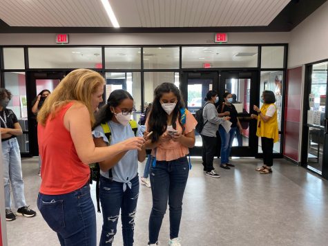 Tuesday was the first day of school in Coppell ISD. CHS9 students walk around the halls during passing period looking for their class. The building is full since there is no virtual learning option for grades 7-12 this year.