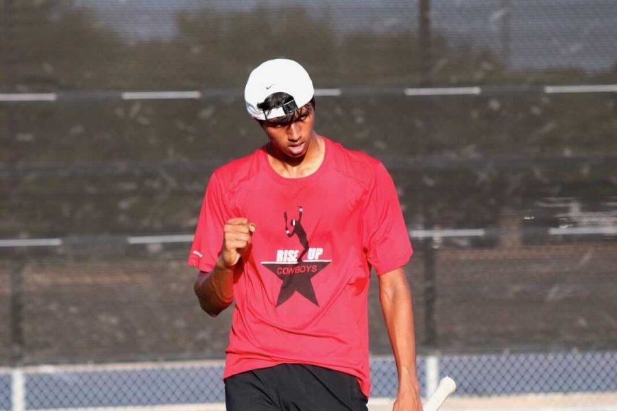 Coppell senior Vinay Patel celebrates a point against Dallas Jesuit sophomore Alex Park on Friday at the Coppell High School Tennis Center. Coppell tennis won against Dallas Jesuit and Ursuline Academy with a combined score of 15-4.