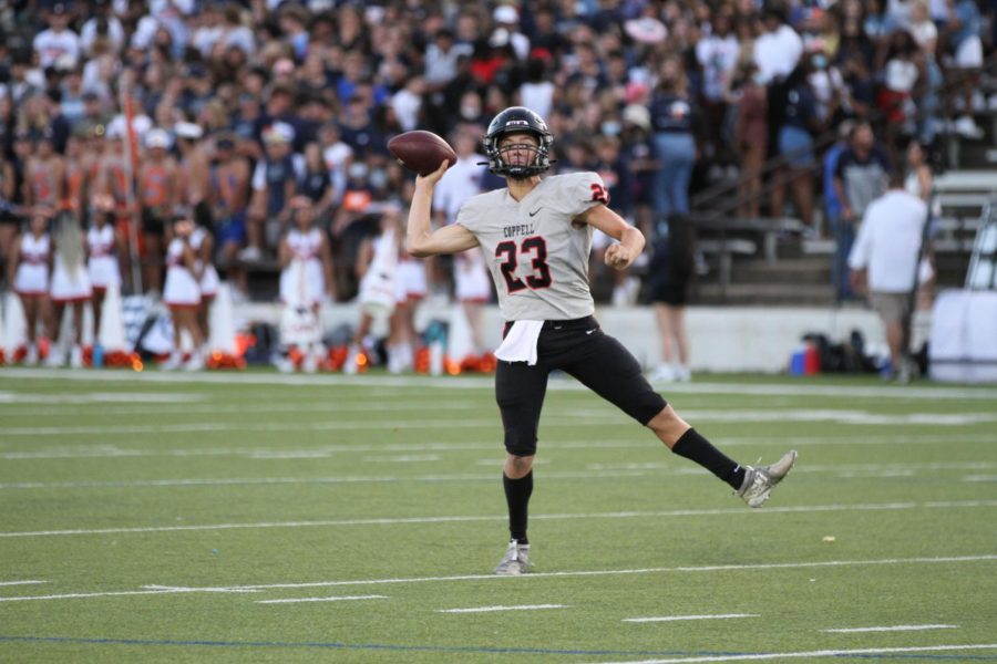 Coppell+junior+quarterback+Jack+Fishpaw+throws+on+the+run+during+the+second+quarter+last+night+at+Homer+B.+Johnson+Stadium+in+Garland.+The+Cowboys+defeated+the+Mustangs%2C+42-28%2C+in+their+season+opener.