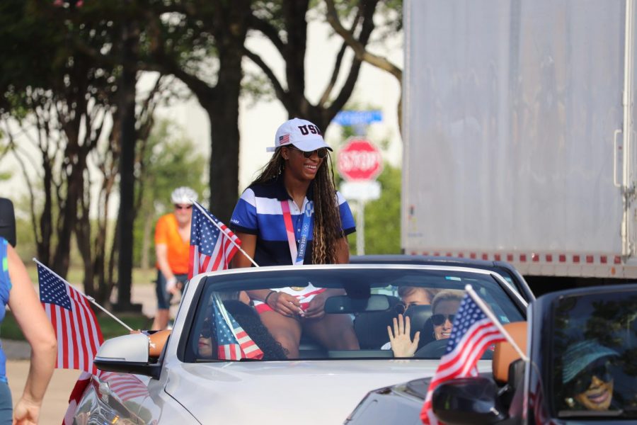 Coppell High School alumna and Olympian Chiaka Ogbogu arrives at the start of the parade surrounded by her family. Ogbogu is the first Olympian from Coppell and won gold alongside the U.S. Olympic womens volleyball team.