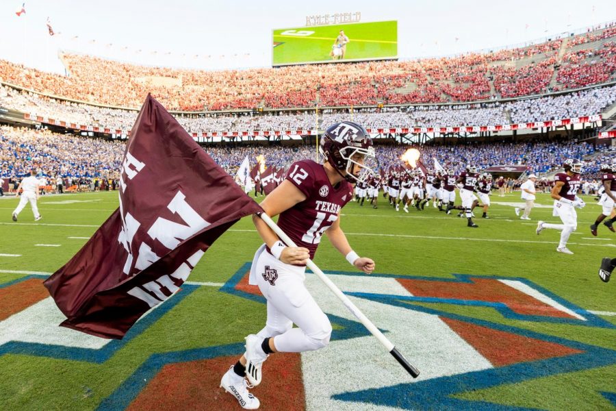 Texas A&M deep snapper Connor Choate runs the flag for the Aggies against Kent State on Sept. 4 at Kyle Field. Choate, a Coppell High School 2017 graduate, was named as the 12th Man for this year on Aug. 28.