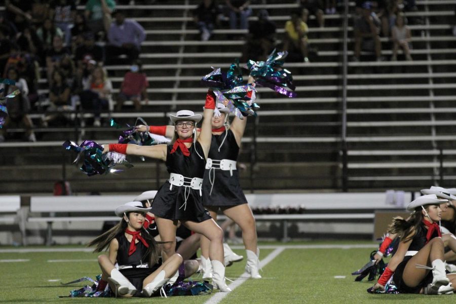 The Coppell High School Lariettes perform at the football game against Sachse High School at Homer B. Johnson Stadium on Friday night. After being replaced with an online raffle and auction last year because of COVID-19, the 31st annual Lariettes Spaghetti Dinner will be held in the CHS Commons tomorrow. 