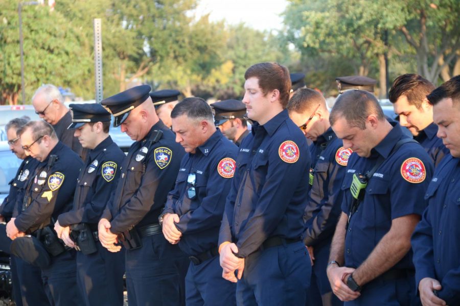 Coppell+police+officers+and+firefighters+bow+in+remembrance+of+the+lives+lost+on+Sept.+11%2C+2001%2C+at+the+Patriot+Day+Ceremony+at+the+Coppell+Town+Center+on+Friday.+Saturday+is+the+20th+anniversary+of+terrorist+attacks+which+took+down+the+World+Trade+Center+towers+in+New+York+City%2C+as+well+as+hijacked+planes+which+crashed+into+the+Pentagon+and+in+Pennsylvania.