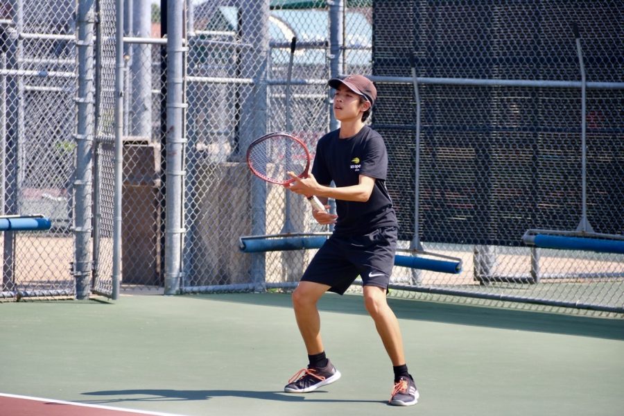 Coppell+tennis+starter+Riki+Koshimizu+warms+up+for+practice+on+Thursday+during+fourth+period.+Koshimizu+has+been+on+the+Coppell+tennis+team+since+his+freshman+year+on+JV1+and+moved+up+to+varsity+within+a+year.+