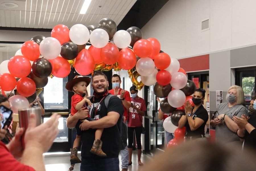 CHS9+Principal+Dr.+Cody+Koontz+is+welcomed+with+a+surprise+celebration+which+was+organized+by+assistant+principal+Jessica+Lynch.+The+event+was+held+to+congratulate+Koontz+on+the+completion+of+his+doctorate+level+degree.