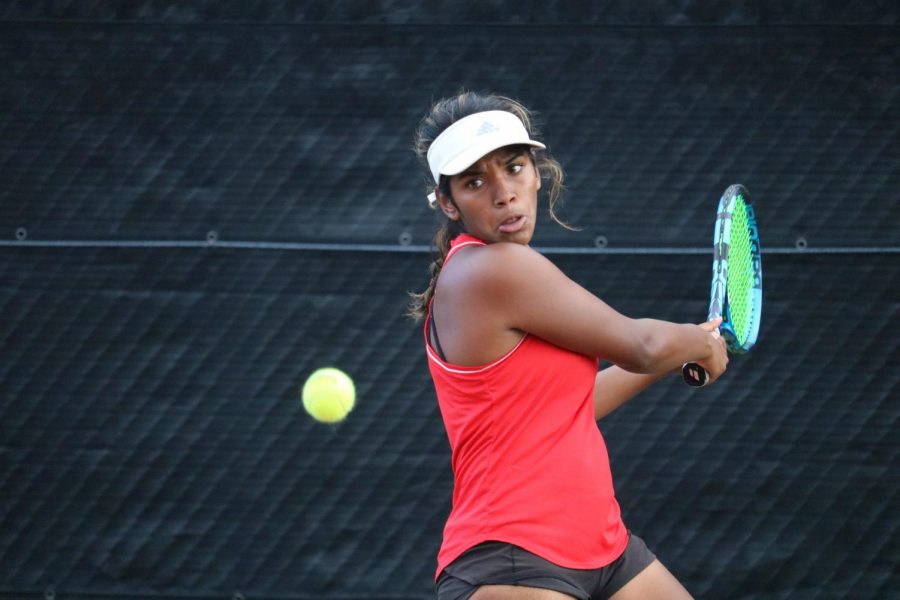 Coppell+junior+Lakshana+Parasuraman+returns+a+ball+in+her+singles+match+in+Coppell%E2%80%99s+match+against+Hebron+at+the+Coppell+Tennis+Center+on+Tuesday.+The+Coppell+tennis+team+defeated+Hebron+16-3.