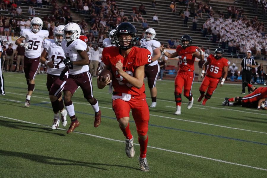 Coppell junior quarterback rushes in for a touchdown during the first quarter against Plano at Buddy Echols Field last night. The Cowboys defeated Plano, 35-13, in their first District 6-6A clash.