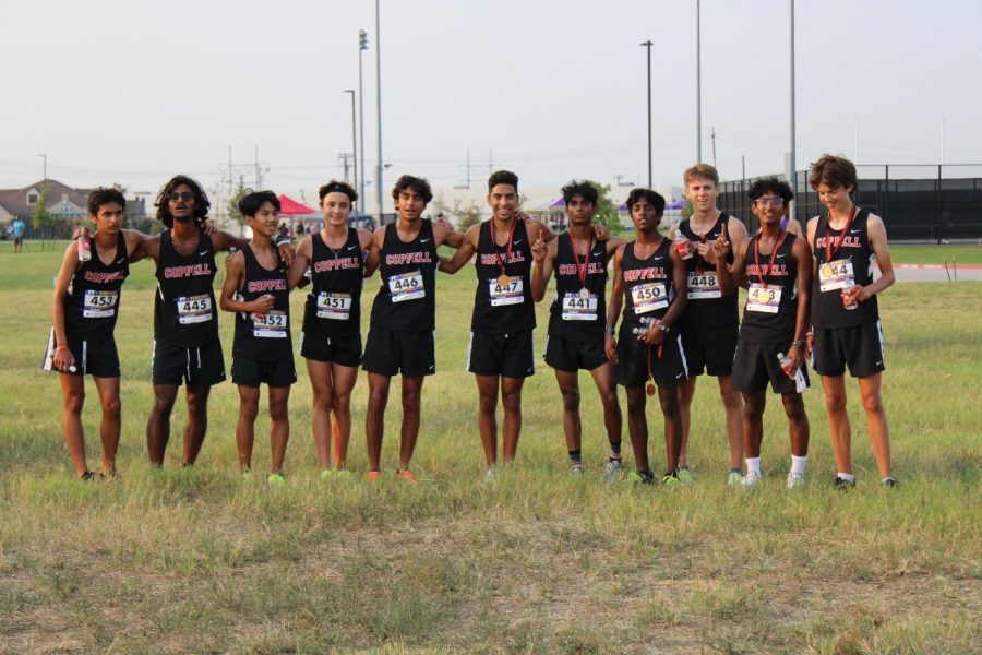 Coppell Varsity boys celebrate their victory on Saturday morning at Coppell Middle School west. Coppell won the invitational meet on a challenging course.
