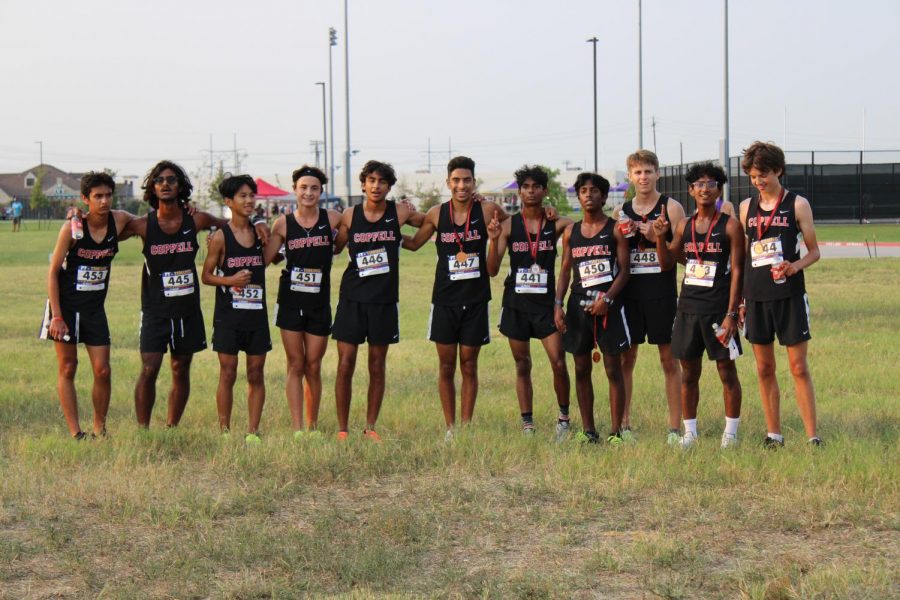 Coppell+Varsity+boys+celebrate+their+victory+on+Saturday+morning+at+Coppell+Middle+School+west.+Coppell+won+the+invitational+meet+on+a+challenging+course.