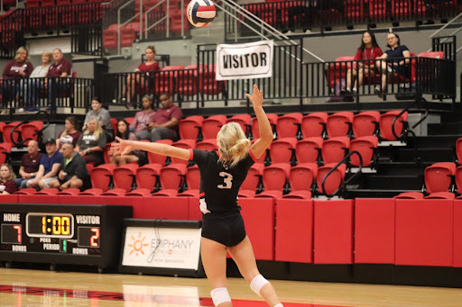 Coppell Junior defensive specialist Karissa Cameron serves against Plano on Sept. 28. The Cowgirls host Plano West tonight at the Coppell High School Arena, starting at 6:30 p.m. 