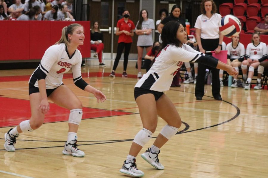 Coppell+senior+defensive+specialist+Meagan+Lee+bumps+alongside+teammate+senior+defensive+specialist+Haley+Holz+against+Plano+East+at+the+CHS+Arena+on+Oct.+12.+The+Cowgirls+season+ended+on+Oct.+29+with+a+loss+to+Hebron+in+a+District+6-6A+playoff+play-in+match.