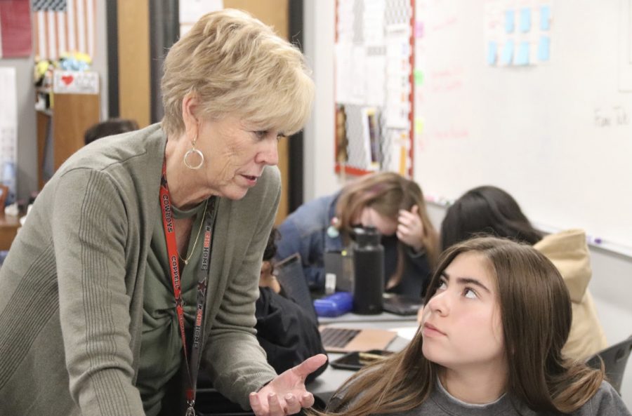 Coppell High School AP English Literature teacher Kim Pearce explains the relationships of Mary Shelley’s Frankenstein to CHS senior Izzy Ortagoza in third period on Thursday. Pearce has been teaching English classes for 38 years.