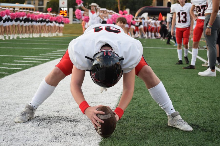 Coppell freshman long snapper Brodie Scoggins practices long snaps before the Cowboys take the field against Plano West on Oct. 1 at John Clark Stadium in Plano. Scoggins was called up to the varsity team in District 6-6A play after Coppell senior linebacker Jake Roemer injured his thumb.