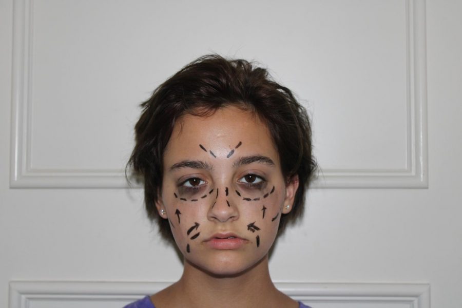 Coppell+High+School+sophomore+Kristen+Remidez+is+seen+looking+scared+with+markings+on+her+face+to+resemble+plastic+surgery+marks.+The+pictures+explore+the+harmful+effects+of+a+negative+social+media+influence+as+well+as+a+poor+body+image.+%0A