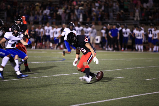 Coppell sophomore wide receiver Luca Grolosi muffs a punt return against Hebron at Buddy Echols Field last night. The Cowboys fell to the Hawks, 34-12.