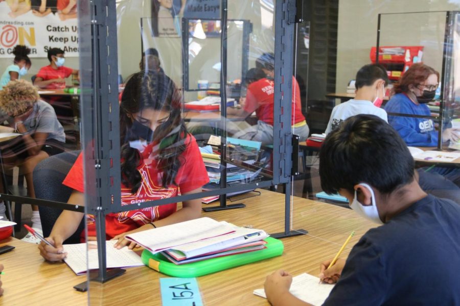 Coppell High School senior Maria Husain grades her students’ work at Gideon Math and Reading in Coppell on Monday. Many local high school students work as a part-time tutor after school at Gideon.
