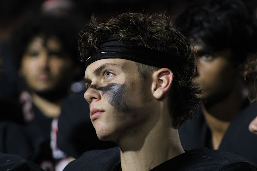 Coppell freshman safety Weston Polk listens as Coppell coach Michael DeWitt addresses the team after a loss to Highland Park on Sept. 10 at Buddy Echols Field. Polk decided, at 10 years old, that he would forgo baseball and has become a cornerstone in the Cowboys’ defense since promotion to varsity. 