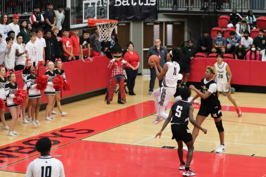 Coppell senior wing Ryan Agarwal scores a layup against Vertical Academy on Nov. 12 at CHS Arena. The Cowboys and Cowgirls host the Coppell Tipoff Classic, a 20-team tournament on Thursday, Friday and Saturday at CHS Arena and Coppell Large Gym. 