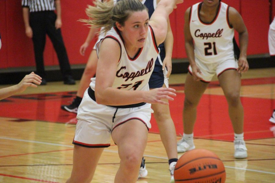 Coppell sophomore guard Ella Spiller leads a fast breaks against Frisco Centennial at the CHS Arena on Friday. The Cowgirls beat Frisco Centennial, 81-42, in their first home game.